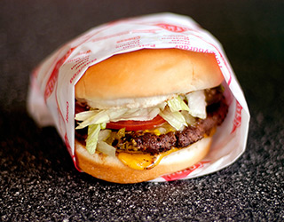 A Fatburger "On the Char" (grilled) resting on the dining table. (Photo: Flickr/Michael Fletcher) 