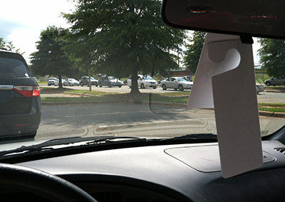 My school carpool line going in zig-zag pattern through the parking lot